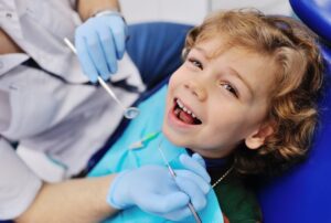 Child smiling at his dental checkup